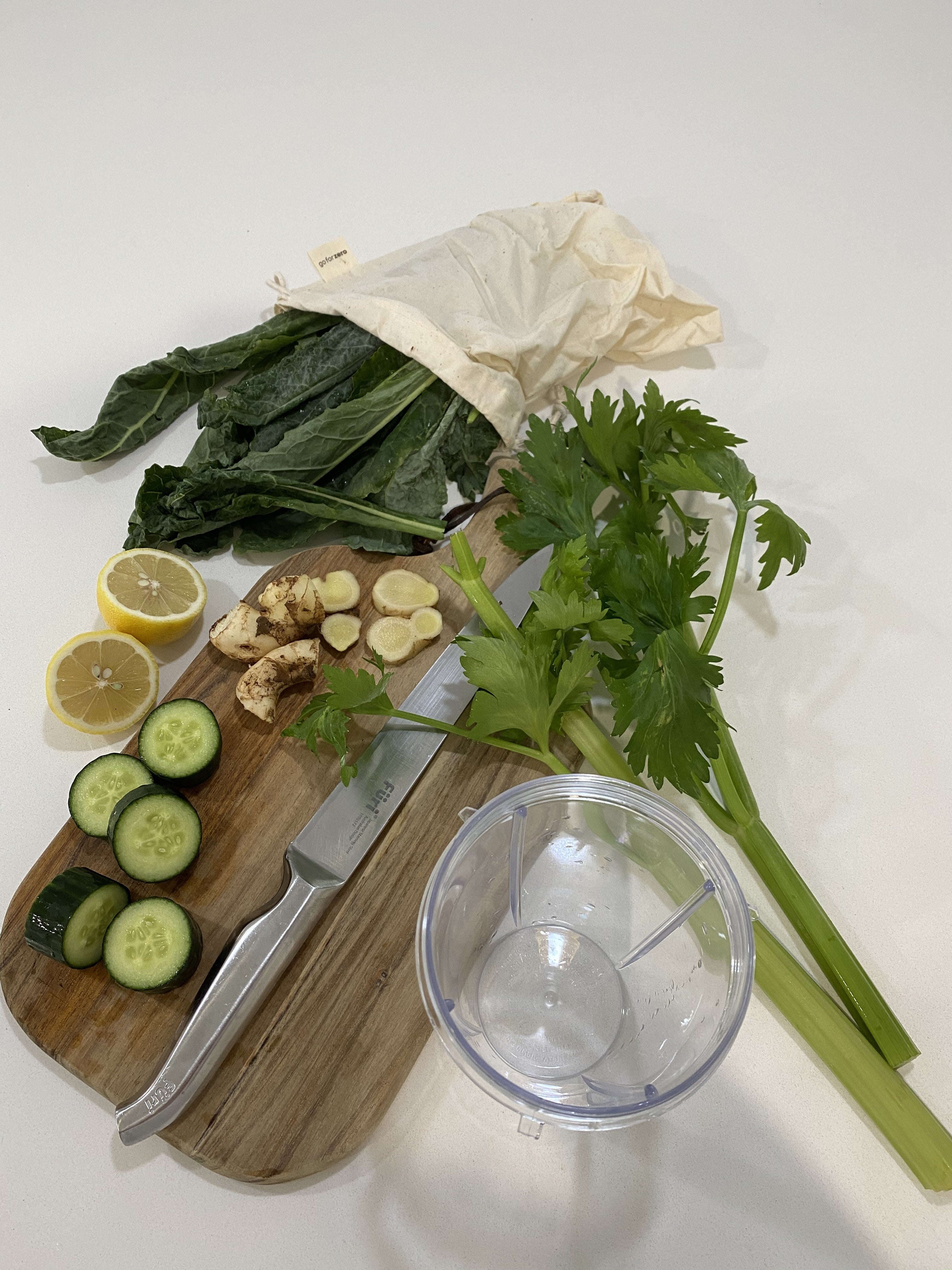 Fresh green juice ingredients on a board